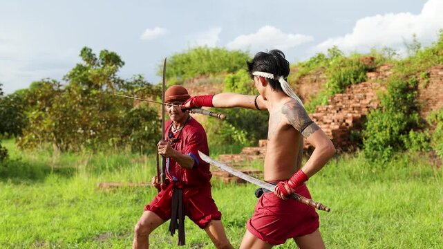 Traditional Thai Martial Arts Sword Fighting Duel at Ancient Ruins