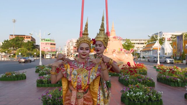 Traditional Thai Khon Dancers Performing in Gold Headdresses Outdoors