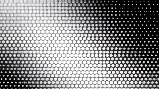A gradient of circles transition from black to white.