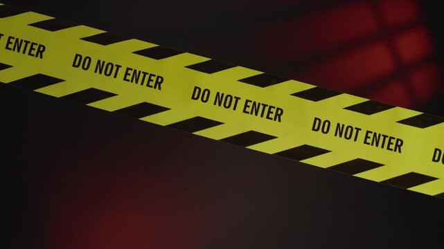 The "Do Not Enter" tape marks a hazardous or restricted area that is strictly off-limits such as a murder scene, an active investigation site, or a danger zone. The shot blurs out at the end.