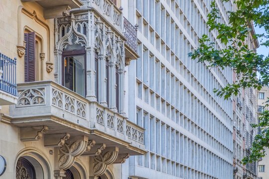 Gothic Balcony Contrasting with Modern Office Building Facade in Barcelona, Architecture Contrast, Old and New, Urban Design