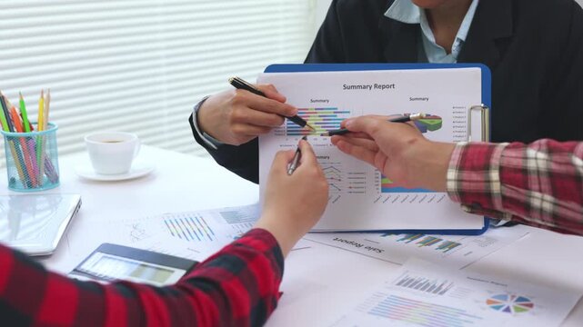Business executives discussing finance, analytics and growth charts in a modern office. Corporate meeting, teamwork, planning, dashboard, data, strategy, 4K.