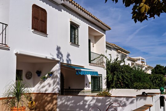 White mediterranean houses with awnings