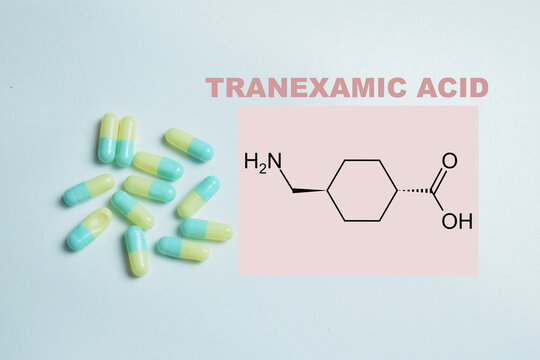 Concept of tranexamic acid write on book isolated on Wooden Table. For bleeding control and hemostasis treatment