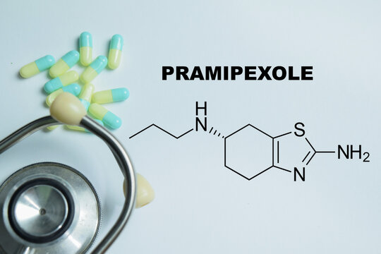 Concept of pramipexole write on book isolated on Wooden Table. For neurological treatment and dopamine receptor therapy