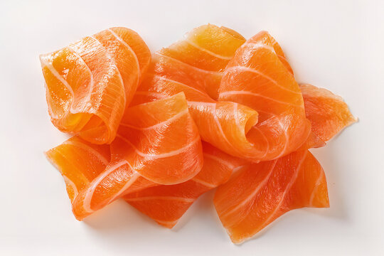 Fresh raw salmon slices on pure white background