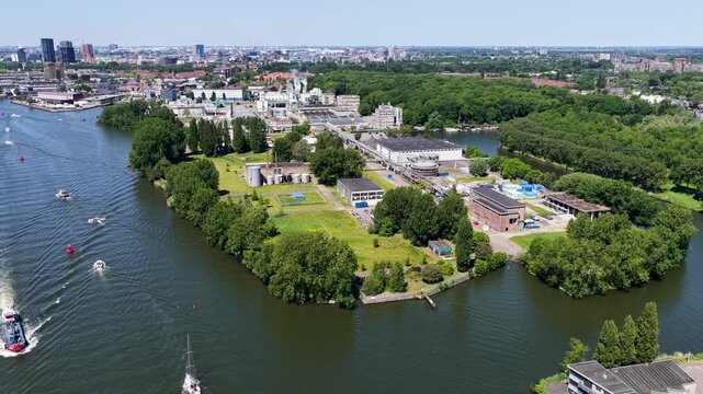 Aerial view of the Ketjen industrial area in Amsterdam-West, the Netherlands, along the IJ river, next to which a new residential area is being built.