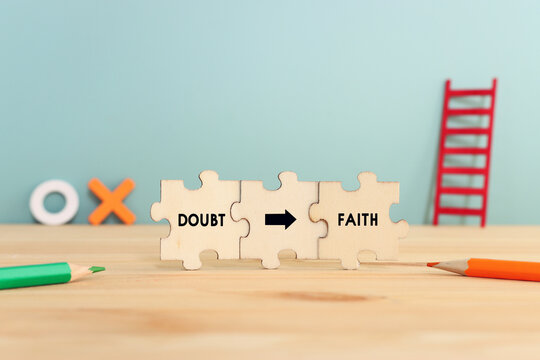Puzzle parts with text. Doubt and faith