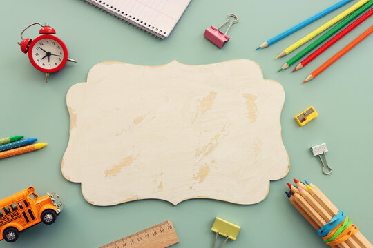 Back to school concept over pastel background. Top view