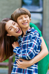 Fototapeta premium A mother shares laughter and affection with her little hearing impaired son.