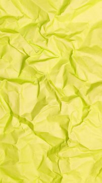 Vertical Abstract Animation of Crumpled Vivid Lime Green Paper Texture Background