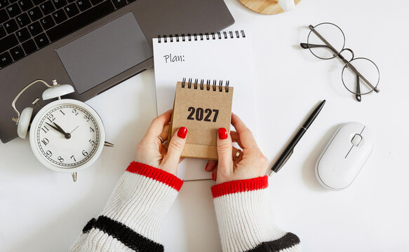 2027 goals and plans concept with notebook and workspace flat lay isolated on white background