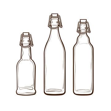Set of swing top clear glass fermentation bottles.