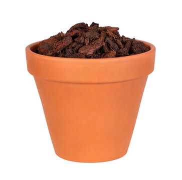 Flower pot with potting mix with pieces of bark isolated on white or transparent background