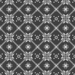 Fototapeta premium Seamless intricate monochrome tribal geometric block cross pattern