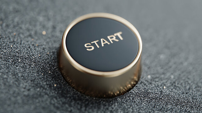 Start button on a black surface ready for use in an electronic device