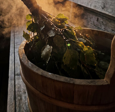 Close-Up of (vihta or vasta in Finnish) Birch Whisk Leaves in Wooden Sauna Bucket