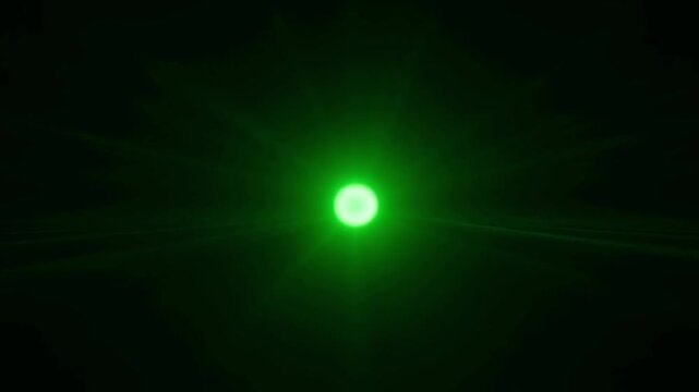 Mysterious green portal opens and closes in dark space with glowing particles