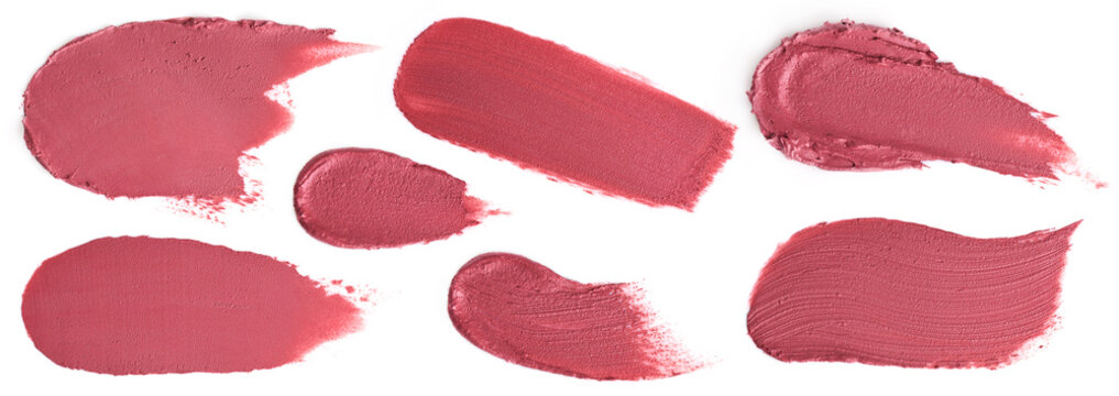 Variety of cosmetic lipstick smears smears isolated on white background.