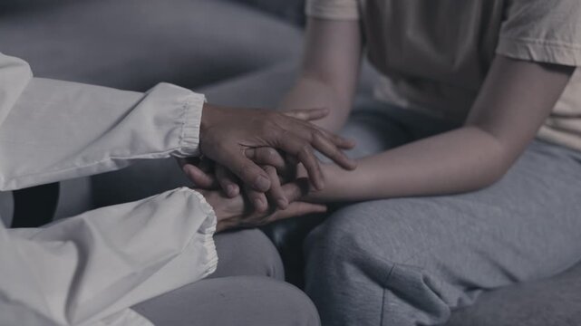 Supportive caregiver listening to a woman facing depression and domestic violence. Mental health, counseling, empathy, trauma, recovery, trust, hope, care, 4K.