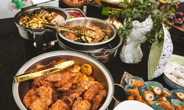 Authentic buffet catering with freshly prepared hot dishes served in stainless steel chafing dishes. Professional food presentation for weddings, parties, corporate events and restaurant hospitality.