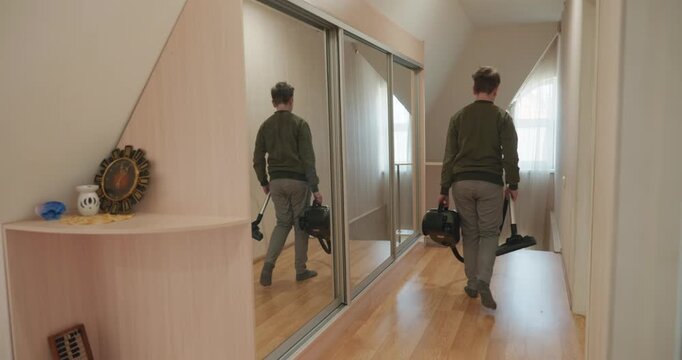 Caucasian Boy Kid Vacuum Hallway Corridor in House. 4K 10-bit