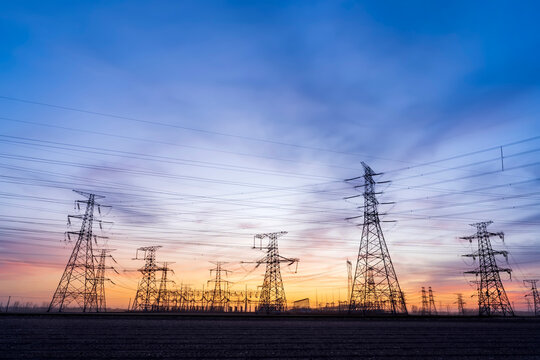 The pylons are in the evening, Substation in the evening, High voltage substation and beautiful sunset glow