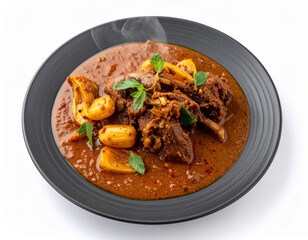 Fototapeta premium Shivamogga Mutton Jackfruit Seed Curry On Denim Blue Plate Isolated On White Background