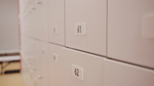 White lockers with numbers in a locker room