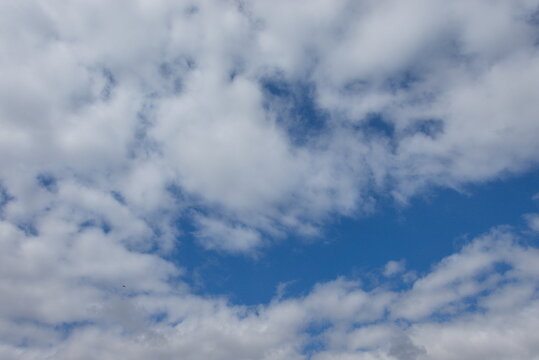 Hampton Water, Peterborough, England, UK - July 01 2026: Beeby's Lake West, Skyscape showing Blue Sky with Scattered Altocumulus Clouds and Open Patches