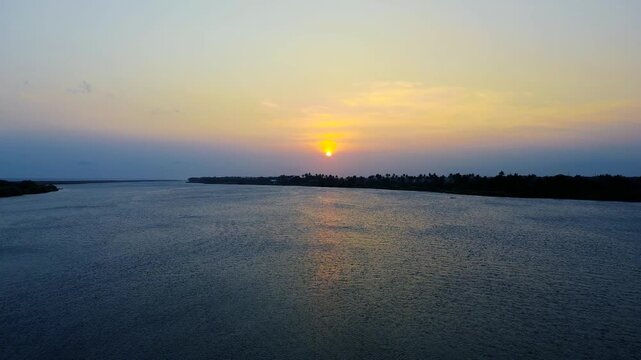 Aerial Drone View of Peaceful Coastal Sunset with Calm Ocean Landscape