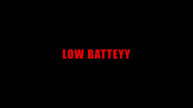 Low battery text animation with red appearing letters on a plain black background.