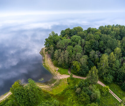 Aerial View of Forest Peninsula on a Calm Lake in Latvia