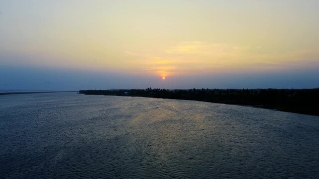 Aerial Drone View of Peaceful Coastal Sunset with Calm Ocean Landscape