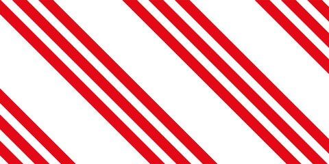 Obraz premium Vertical red and white stripes background. Seamless and repeating pattern.
