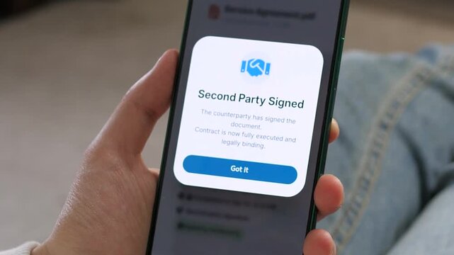 Mobile notification confirms a remote contract signature. Close-up of the Second Party Signed popup. Ideal for remote work, virtual deal-making, and SaaS collaboration tools.