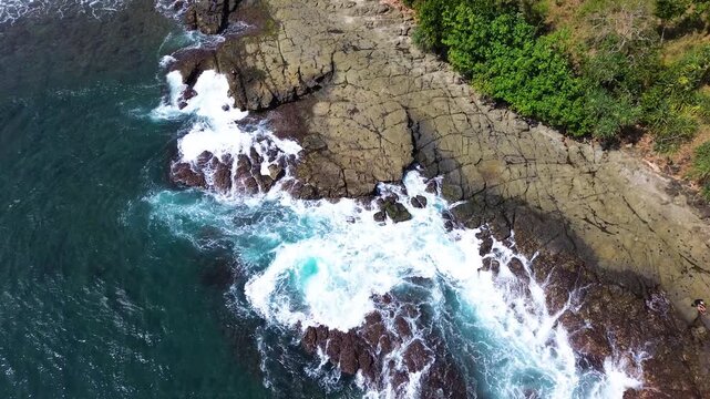 Top Down Aerial Drone View of Ocean Waves Crashing on Sandy Beach