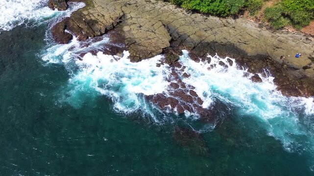 Top Down Aerial Drone View of Ocean Waves Crashing on Sandy Beach