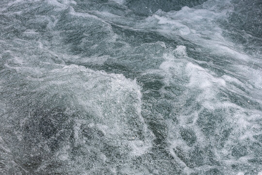 Turmoil of churning water, frothy and swirling