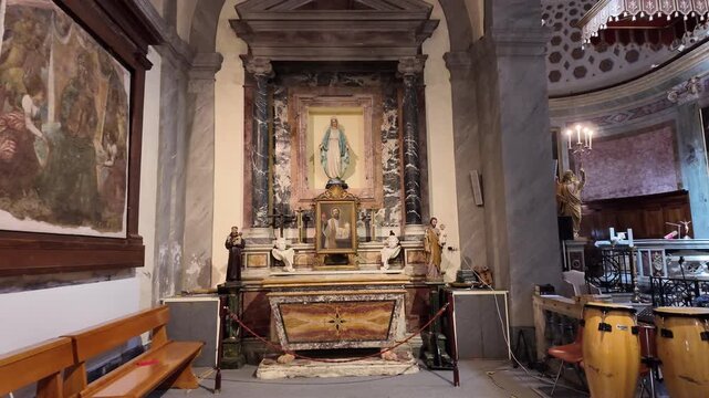 Side altar dedicated to the Virgin Mary inside Sant'Angelo in Pescheria church in Rome