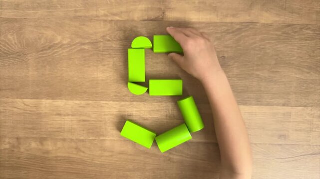 Child Completes the Number 5 Shape with Green Wooden Blocks, 4K