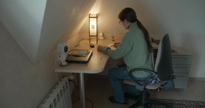 Girl Draw Pictures With Pencil on Desk Table in Bedroom at Home. 4K 10-bit