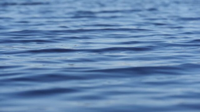 Water s surface, reflecting sky s mood.