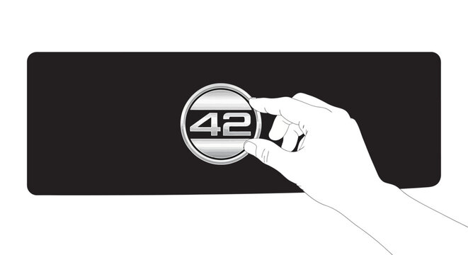 Hand placing number 42 symbol on black background, concept of answer or solution