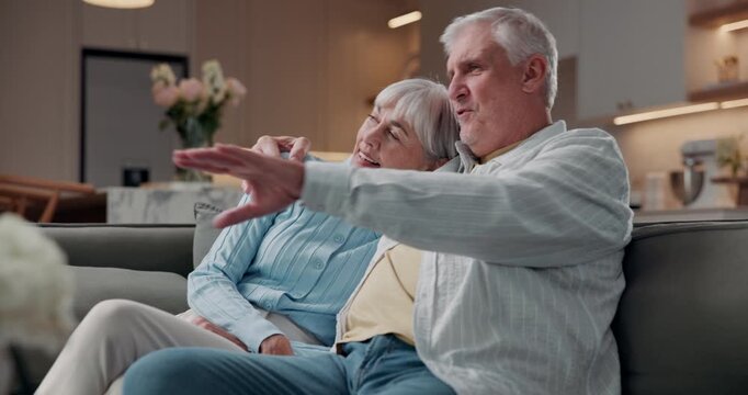 Senior, couple and watching tv in living room with hug, smile and bonding together for retirement. Married, elderly people and relax in house with embrace, streaming film and discussion for movie.