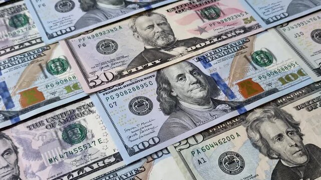 Paper US dollar bills of various denominations and cent coins as a business tool for exchange and trade. Cash US dollars as a background for your design