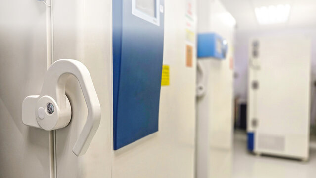 Selective focus of ultra low temperature -70 degree celsius freezer for keeping specimens for laboratory testing in hospital.Front of refrigerator storage blood from patient for research in university