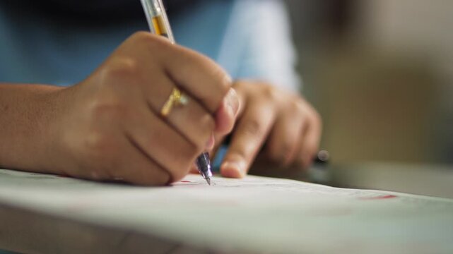 Woman Hand Signing Document Close Up