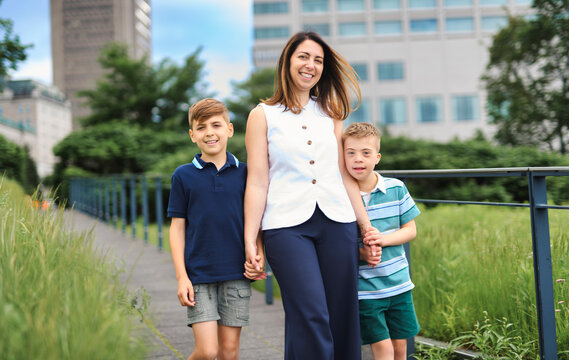 family of three outside people in summer season.