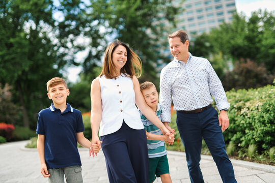family having great time in city walking together